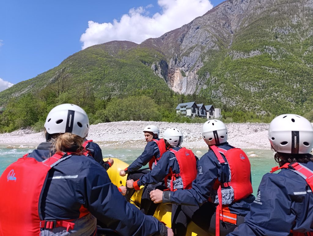 White water rafting on the emerald Soča River in Bovec Slovenia. View on Boka waterfall
